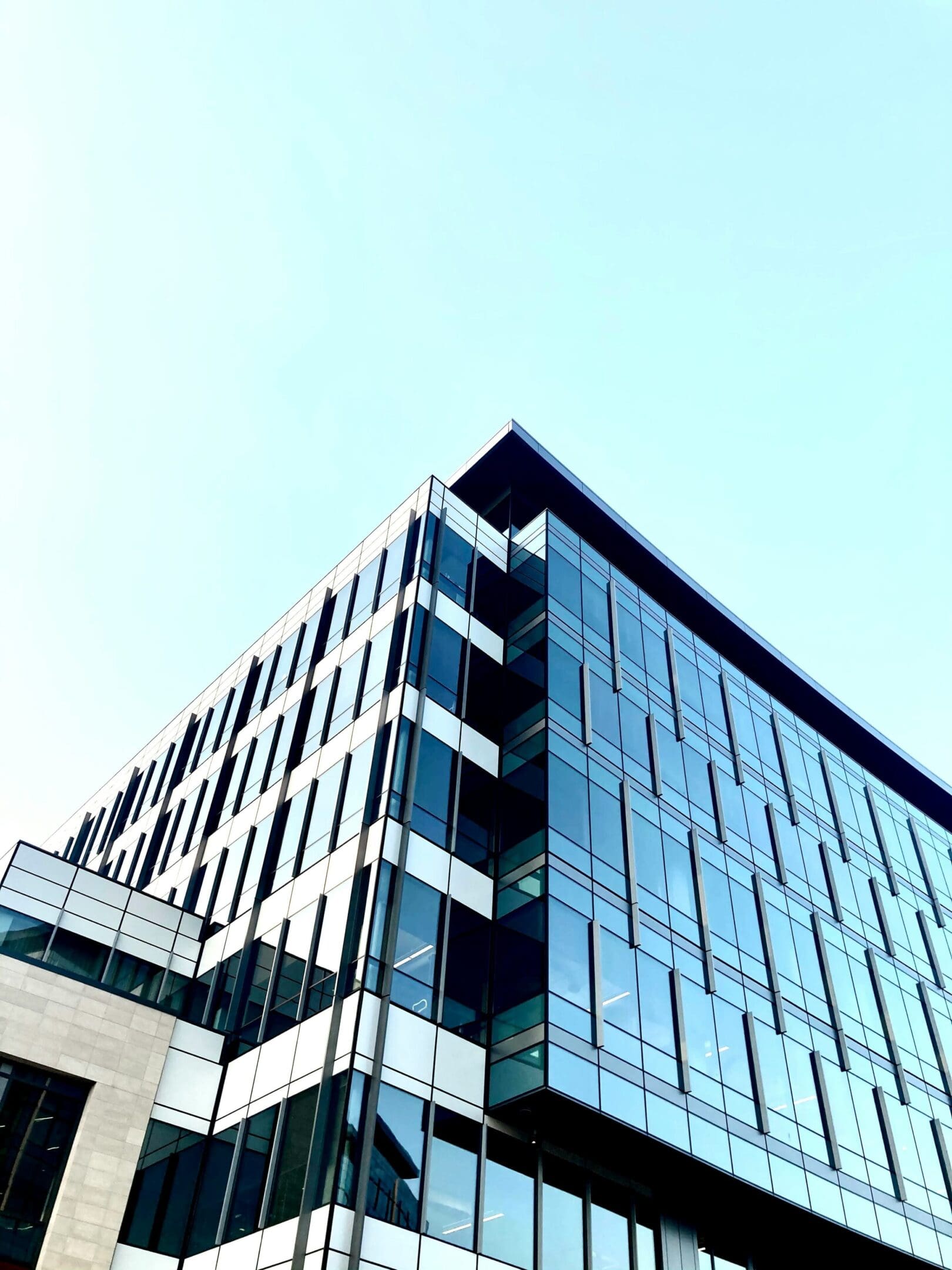 A tall building with many windows on the outside.