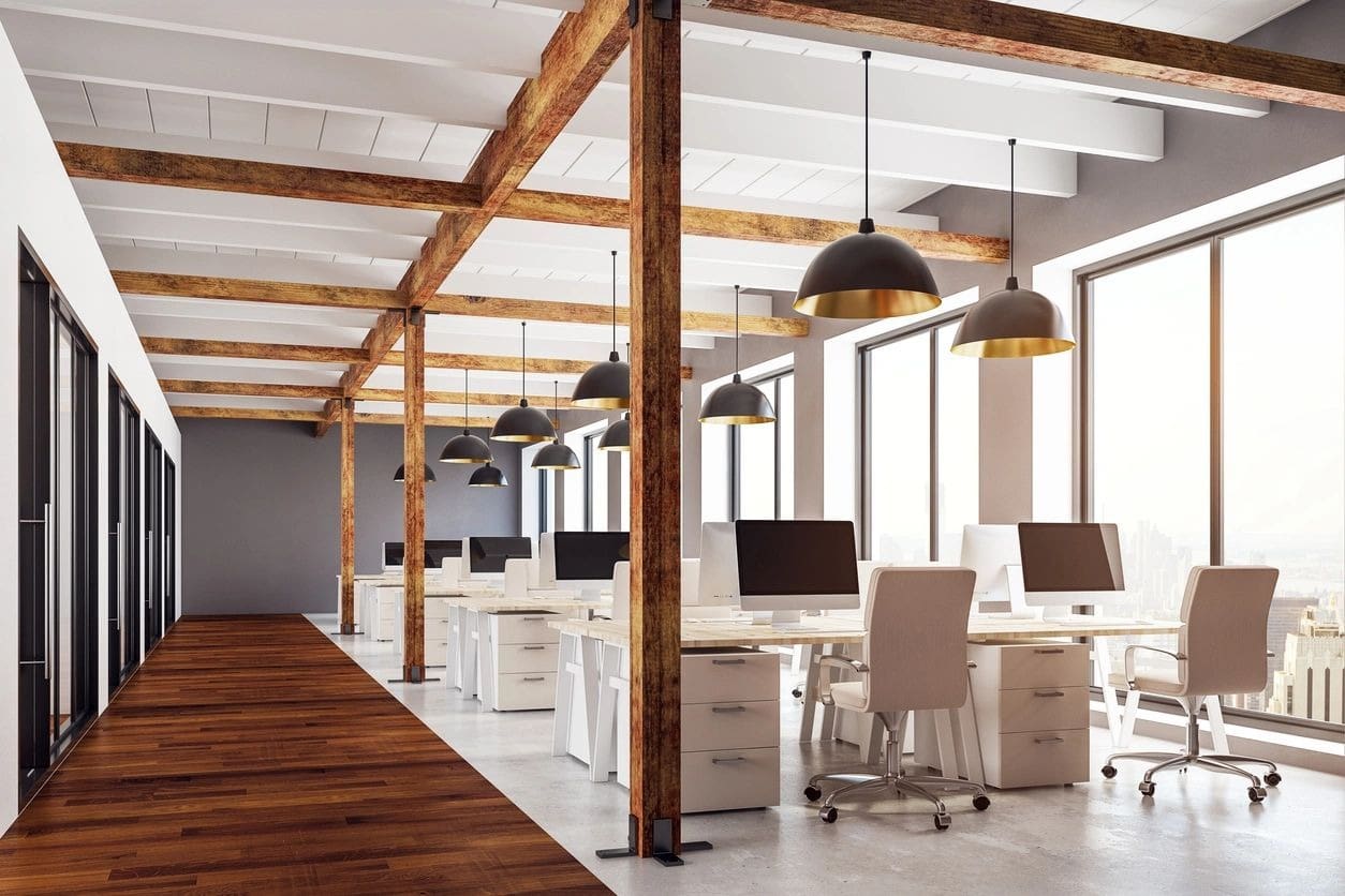 A large open office space with desks and chairs.