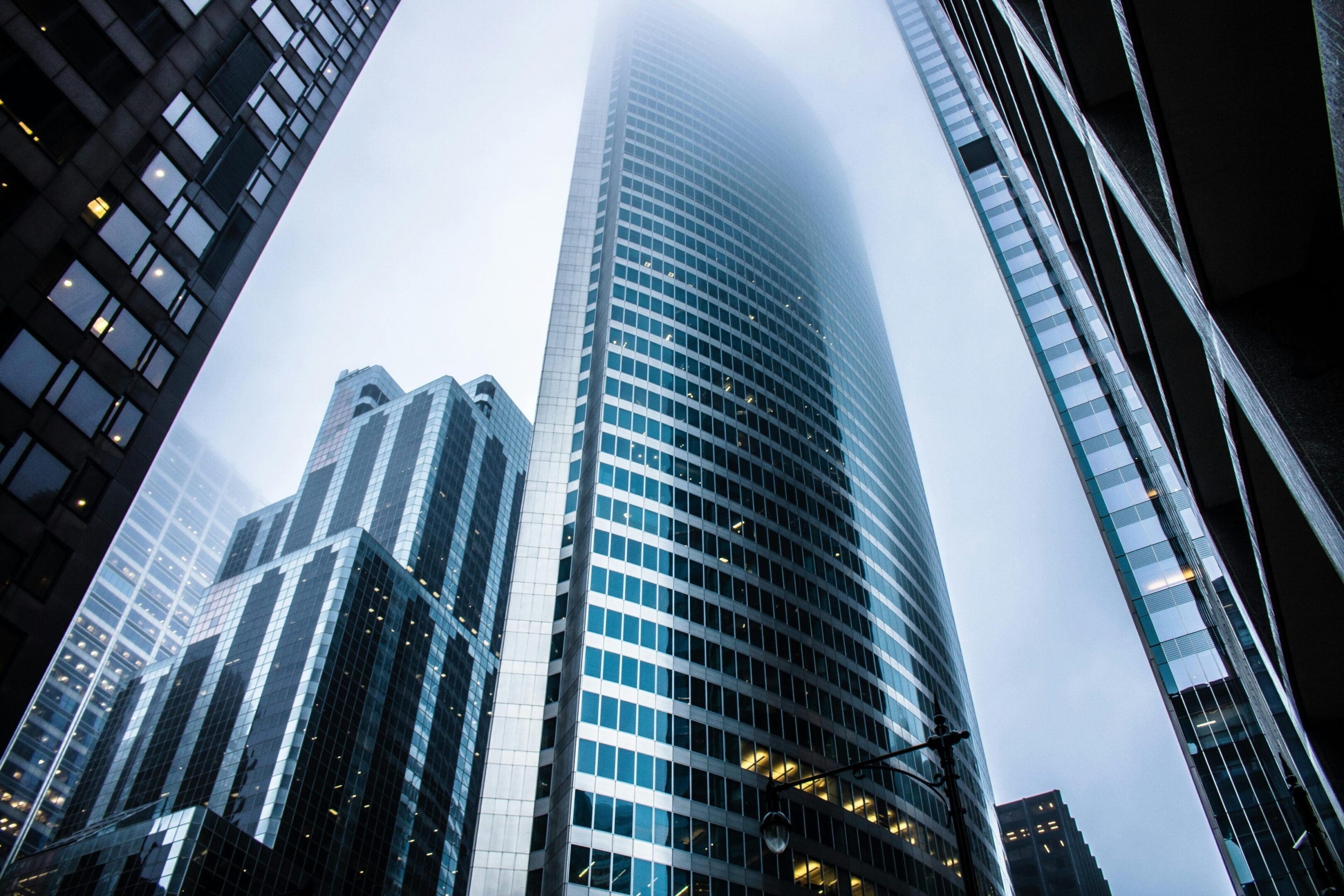 A tall building with many windows in the middle of it